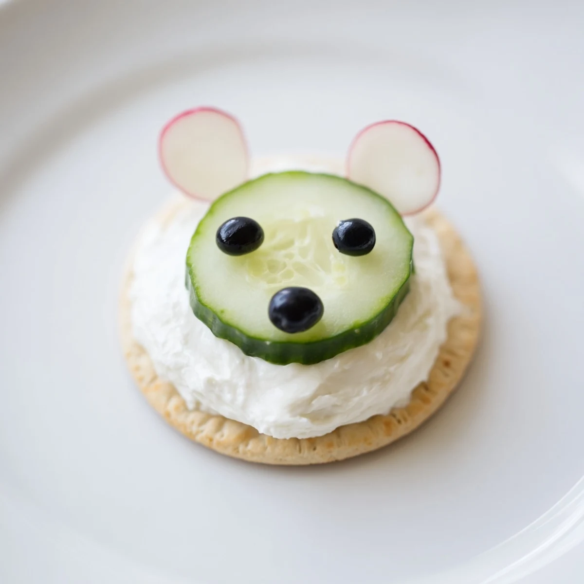 Creamy Polar Bear Iceberg Cracker Stacks featuring crisp cucumbers and olives; a fun appetizer.