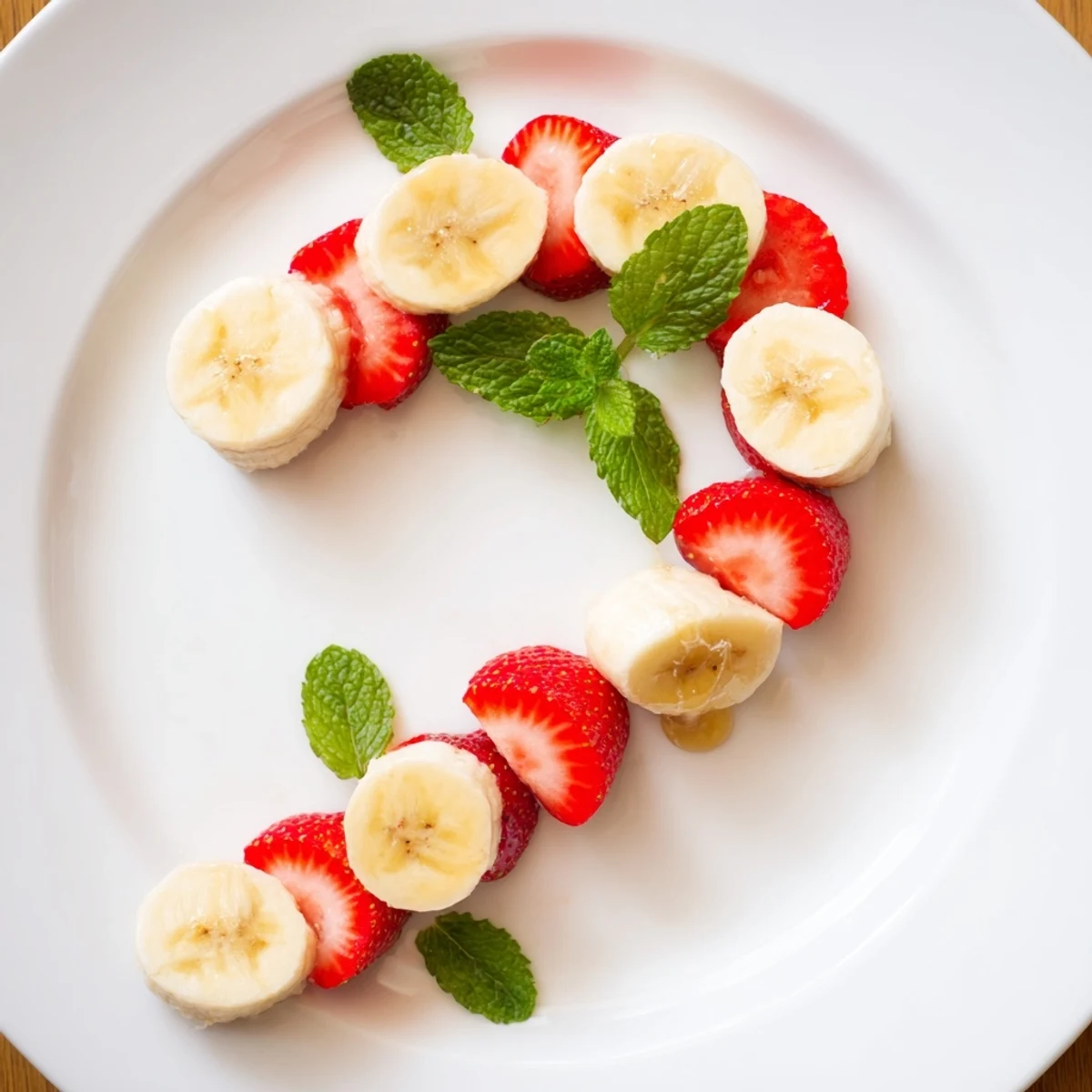 Freshly assembled Banana Strawberry Candy Cane: a festive, colorful holiday treat made with sliced fruit.