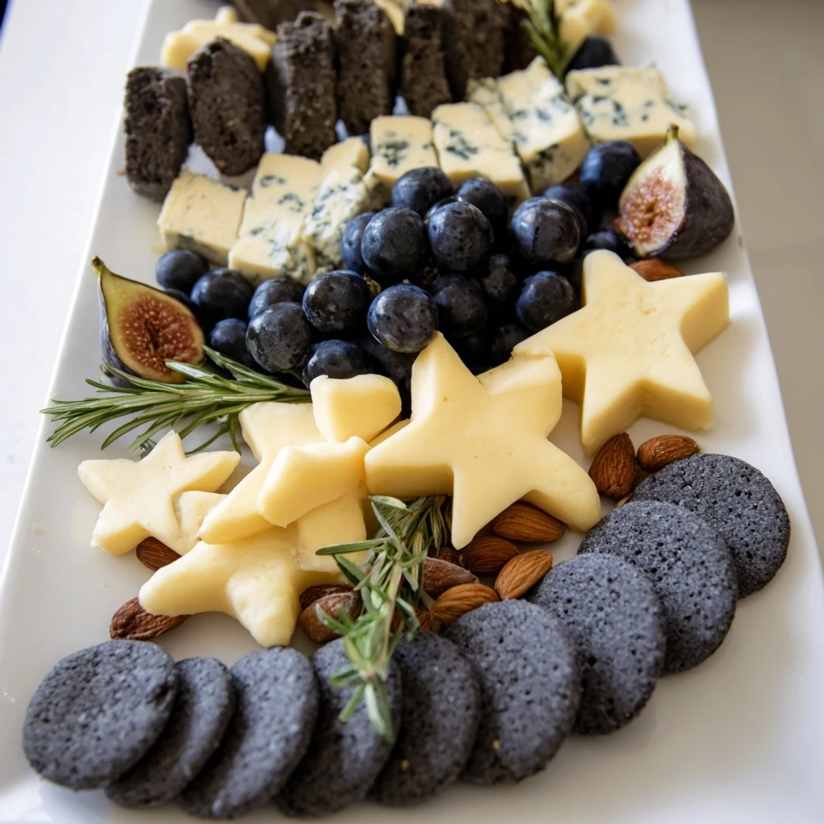 Crescent Moon & Stars Cheese Board: A vibrant photo shows the cheeses and crackers arranged artistically on a platter.