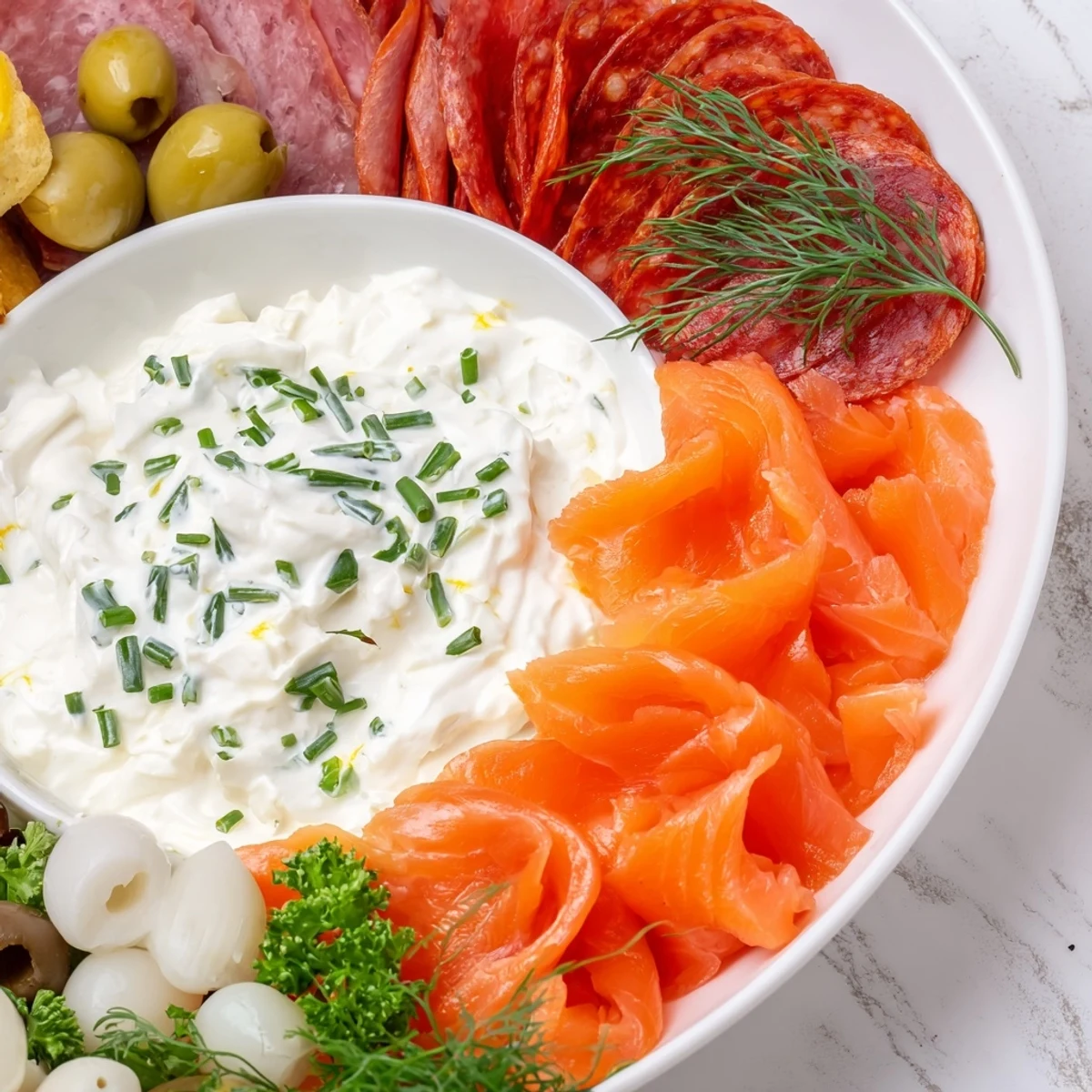 This stunning Compass Rose features savory meats arranged around a flavorful, central dip for sharing.