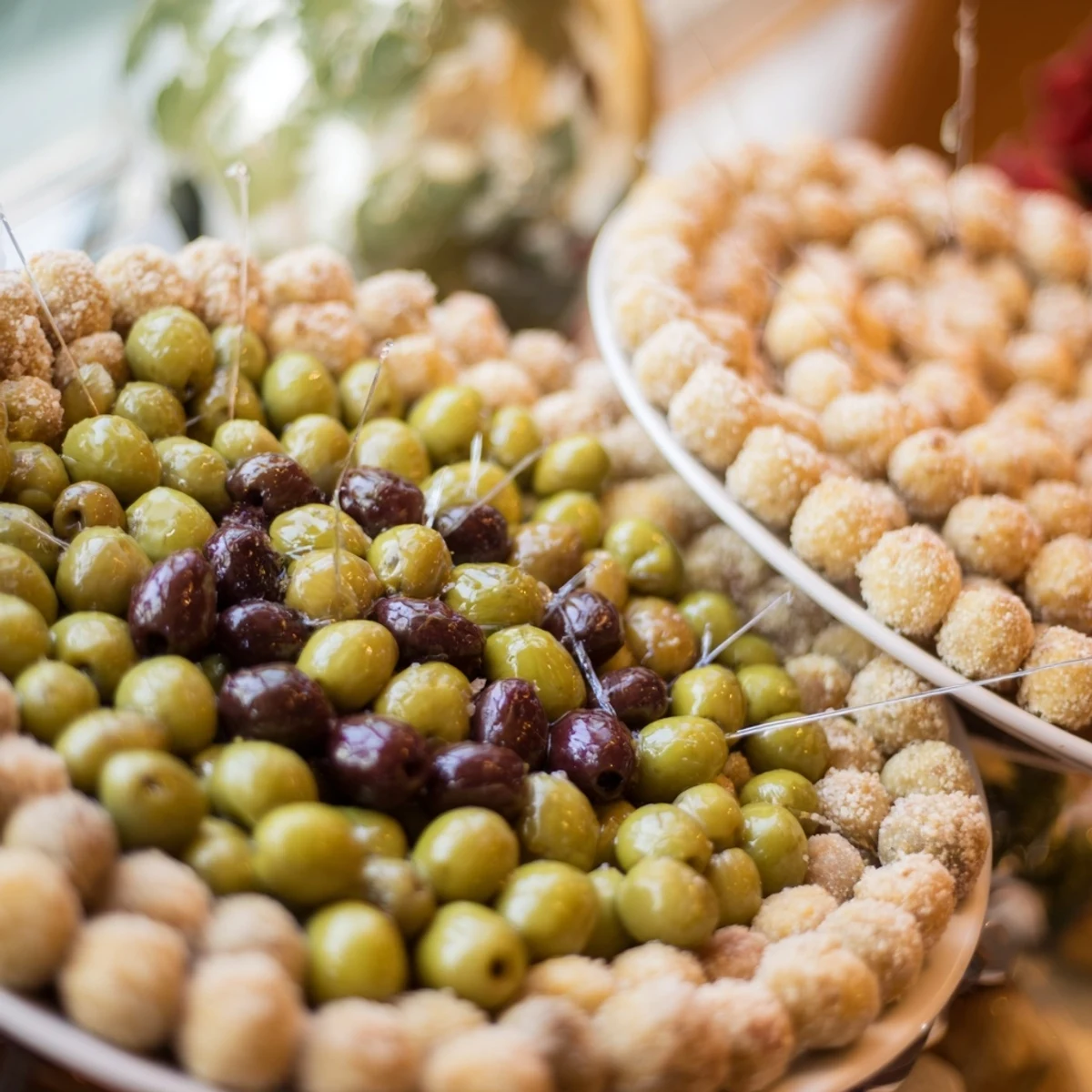 The Roman Colosseum snack platter with olives looks like a fun, circular party appetizer.