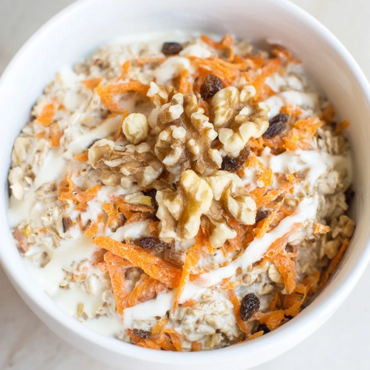 Creamy Carrot Cake Overnight Oats, layered with grated carrots and a perfect breakfast treat.
