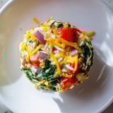 Perfectly baked, fluffy customizable egg muffins with colorful vegetables, perfect for a quick breakfast.