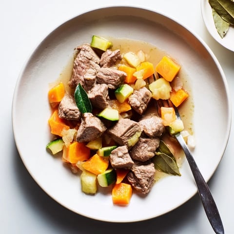 A vibrant photo of a Sweet Lamb Platter for Baby, featuring tender lamb and colorful vegetables.