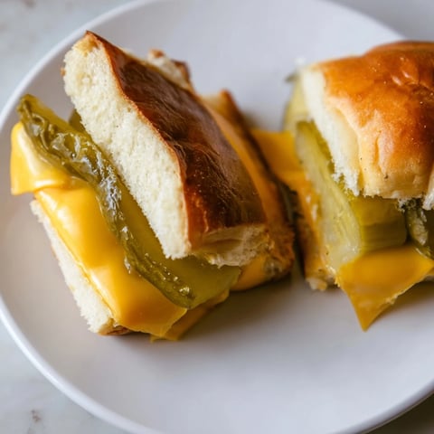 Golden-brown Pickle Bread Sandwich, a low-carb treat with melted cheddar and tangy pickles.