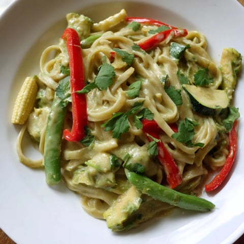 Golden swirls of creamy Thai Curry Pasta, topped with fresh cilantro, ready to serve and enjoy.