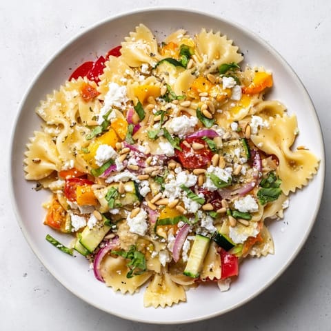 A close-up of a finished festive bow tie pasta platter, ready for a special celebration.
