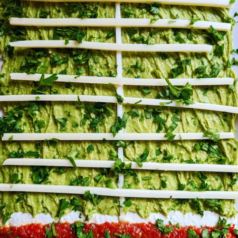 A delicious Game Day Football Field Snack Board, complete with salsa end zones and veggie dippers ready to enjoy.