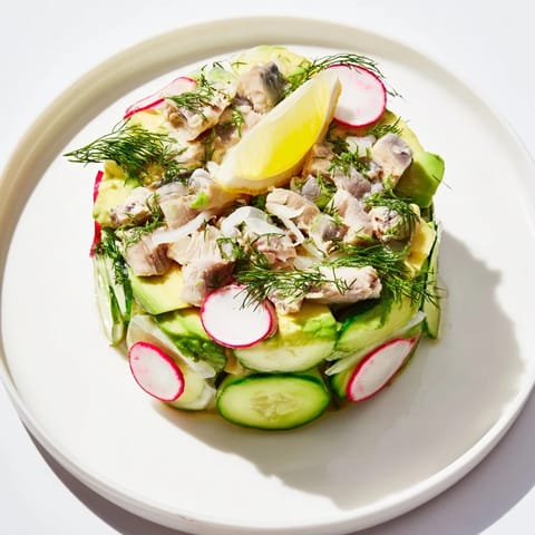 A close-up of a refreshing Cucumber and Tinned Fish Date Night Salad, perfect for a light supper.