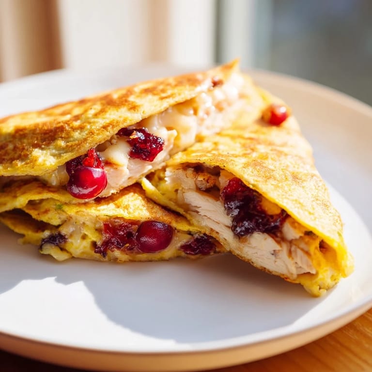 Imagine a close-up of the delicious Turkey, Stuffing & Cranberry Leftovers Tortilla Wrap, ready to eat.
