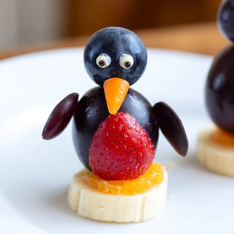 Imagine colorful Mandarin orange feet and grape bodies in this charming Penguin Fruit Skewer Army.