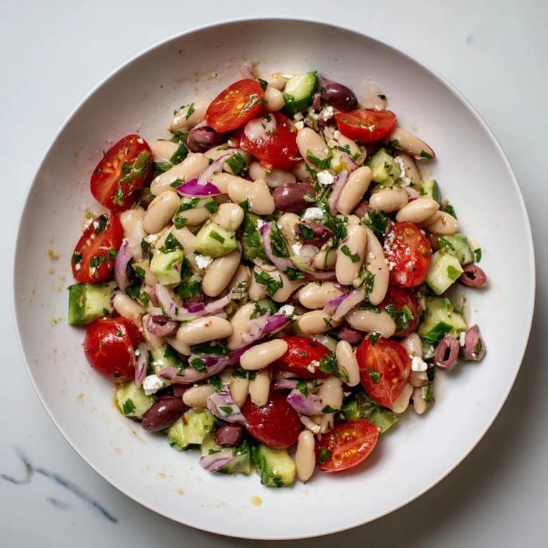 Close-up of a delightful and healthy White Bean Salad: showcasing herbs, inviting you to enjoy this dish.