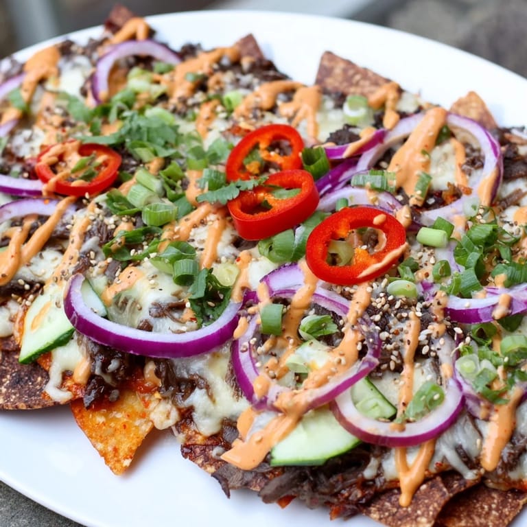 A close-up of delicious Korean BBQ Nachos: a fusion of flavors and textures, ready to enjoy.