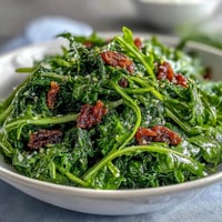 A vibrant arugula salad with tangy lemon vinaigrette and delicate Parmesan shavings, perfect for a light lunch or elegant starter.