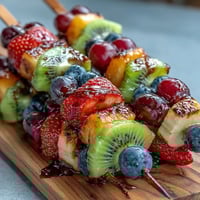 Vibrant bento box filled with colorful fruit skewers, creamy yogurt dip, and wholesome sandwich bites—perfect for a fun, nutritious kid's lunch.